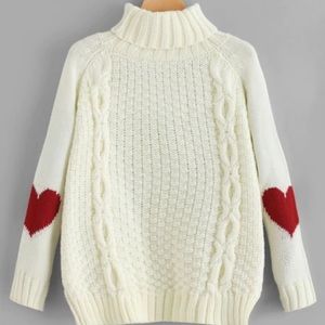 White sweater with adorable hearts on elbows.